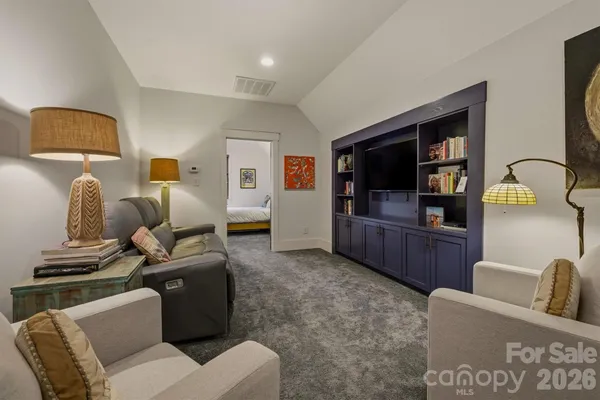 a bedroom with a bed and ceiling fan