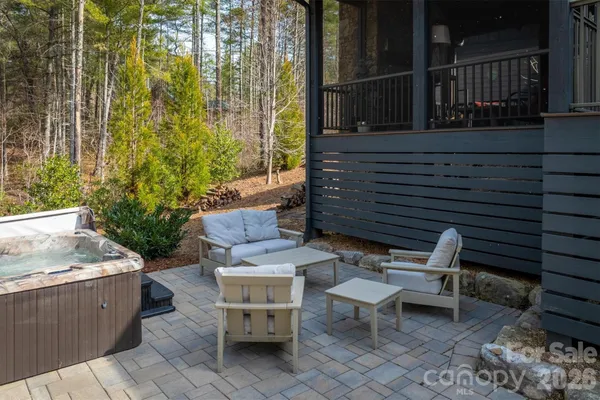 a backyard of a house with outdoor seating