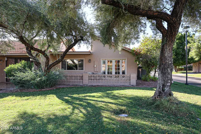 a view of a house with a yard