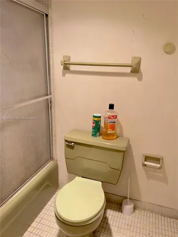 a bathroom with a toilet and a sink