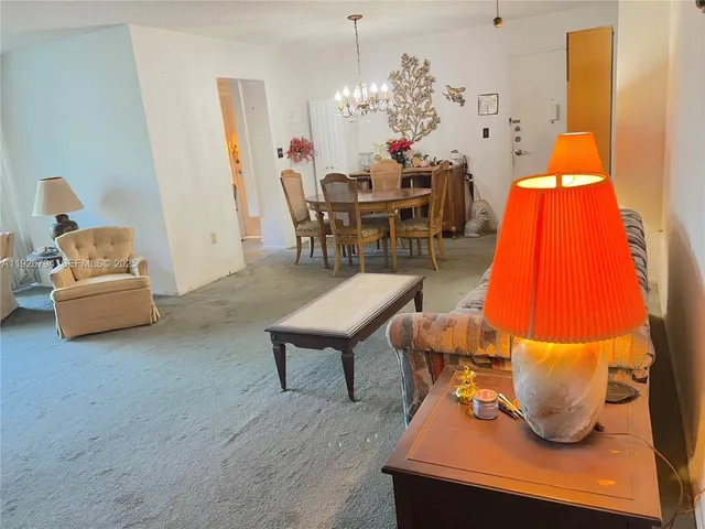 a living room with furniture and a table