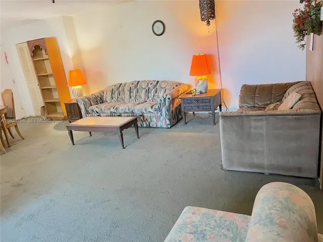 a living room with furniture and rug