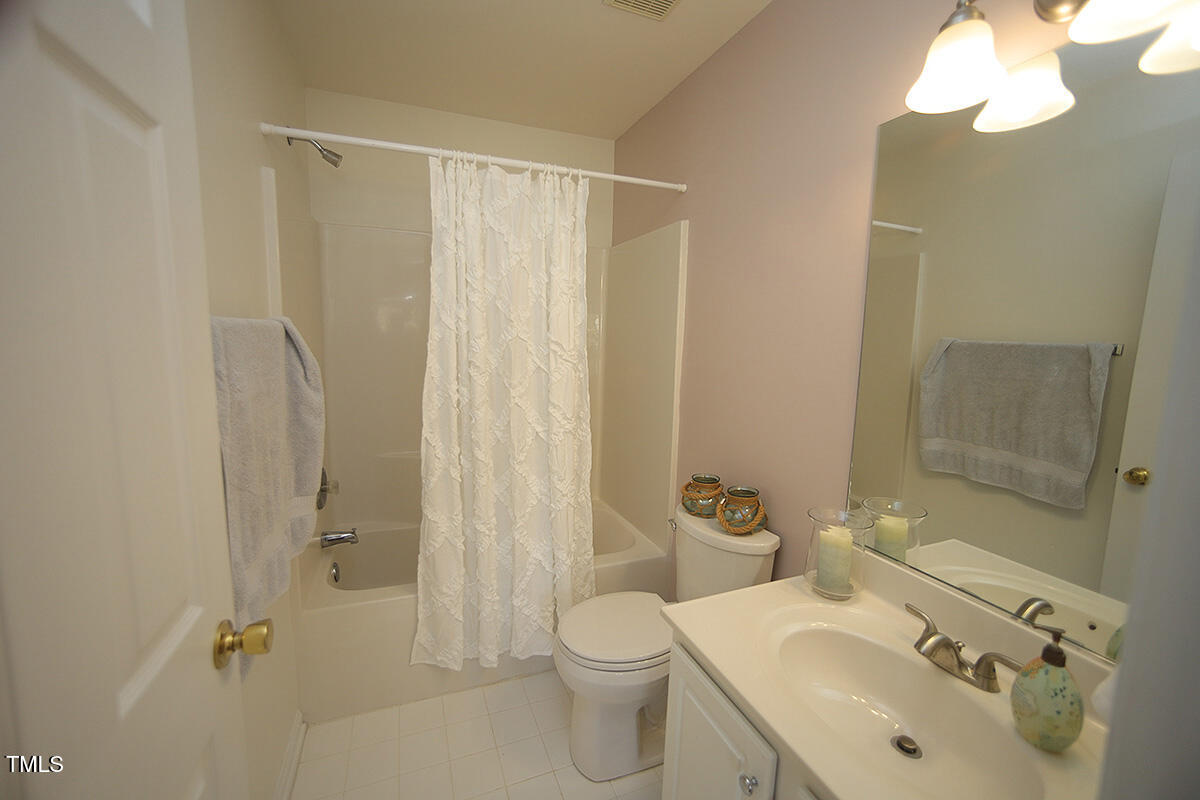 5744 Corbon Crest Lane Raleigh, NC 27612 - Photo 11 of 18 2nd bedroom has its own bathroom. Freshly painted