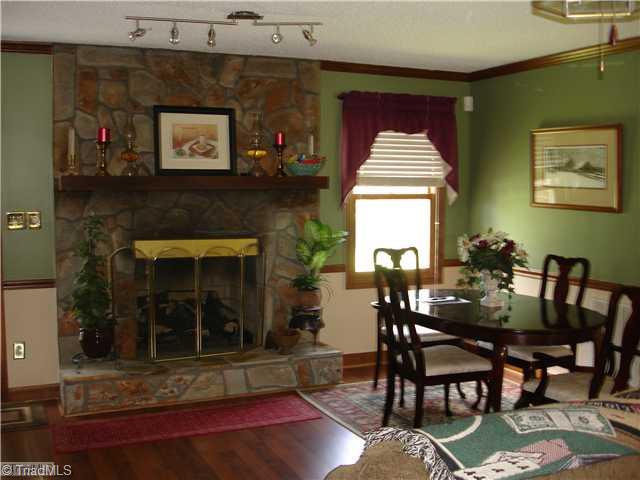 2850 Slate Road King, NC 27021 - Photo 3 of 16 Living Room. Huge living room w/stone fireplace(gas logs) opens to rear deck. Recent paint and laminate floors.