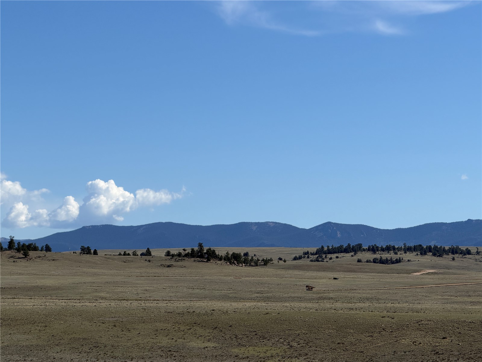 3530 Goldenburg Canyon Road Hartsel, CO 80449 - Photo 6 of 18 a view of an lake and sunset