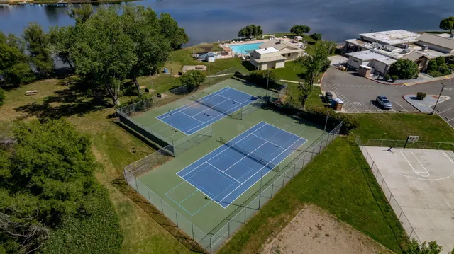 a view of an outdoor space and tennis court