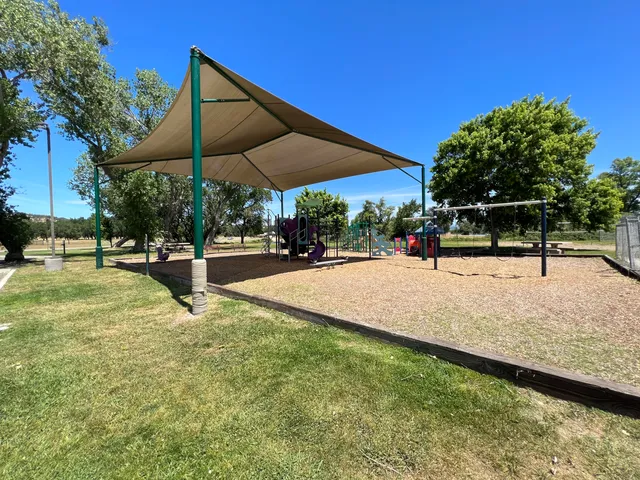 a view of a swimming pool and lounge chairs