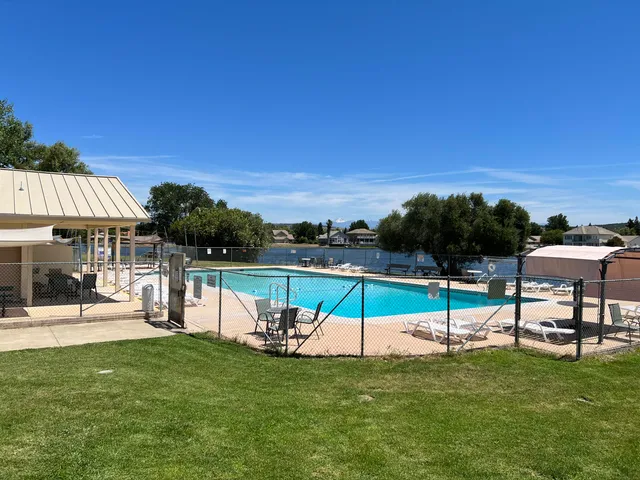 a view of a chairs and table in patio
