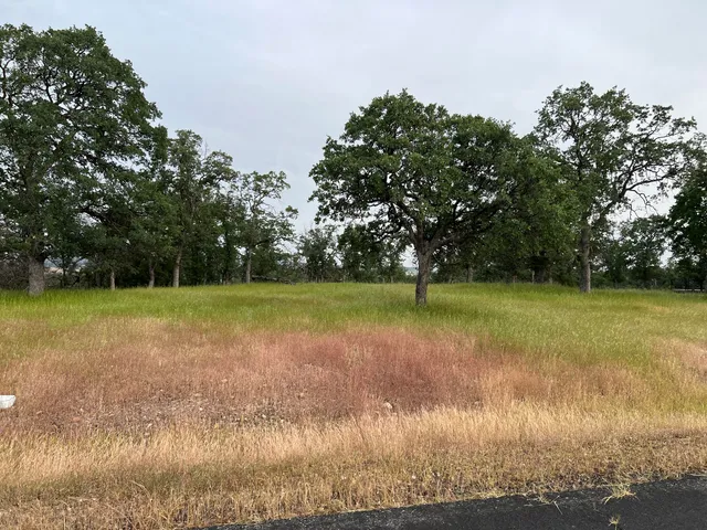 a view of a swimming pool with an outdoor space and seating area
