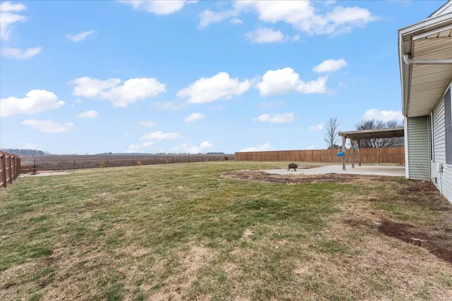 a large body of water with a building in the background