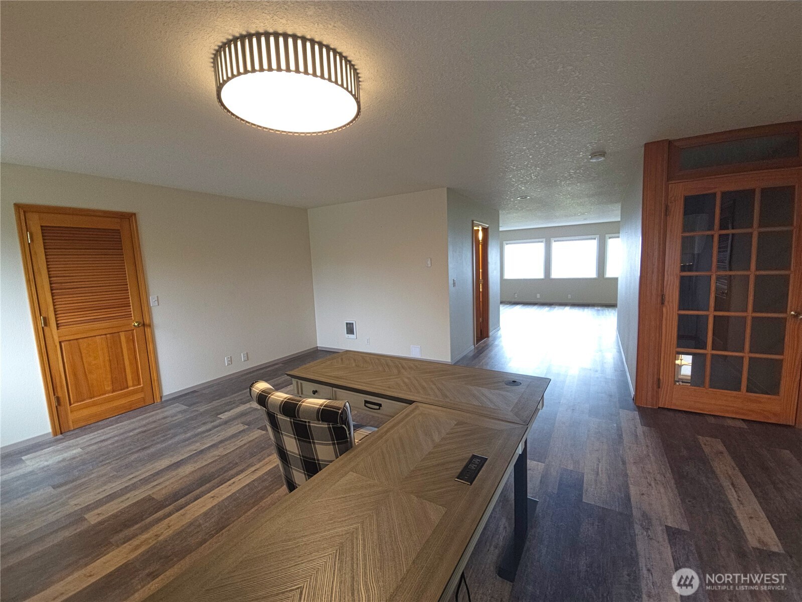 240 Stringtown Road Ilwaco, WA 98624 - Photo 13 of 39 a view of a livingroom with wooden floor