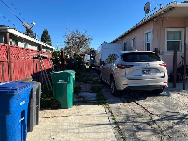 a view of a car park in front of house
