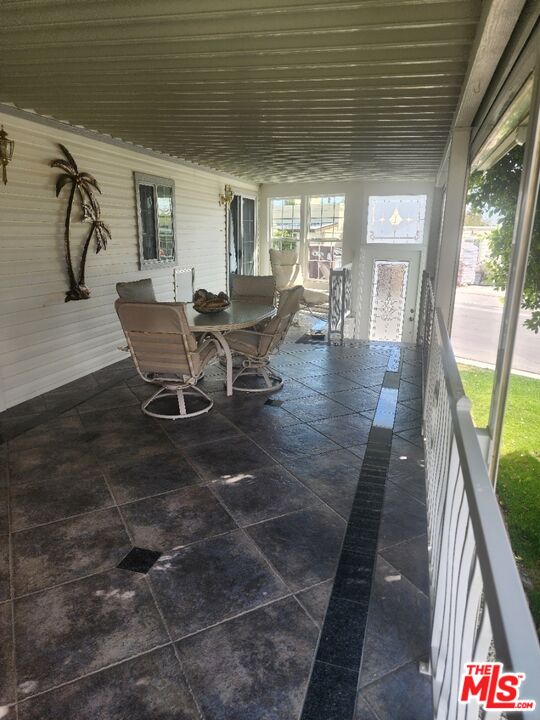 84136 Ave 44, Unit 306 Indio, CA 92203 - Photo 6 of 13 a view of a dining room with furniture and a table