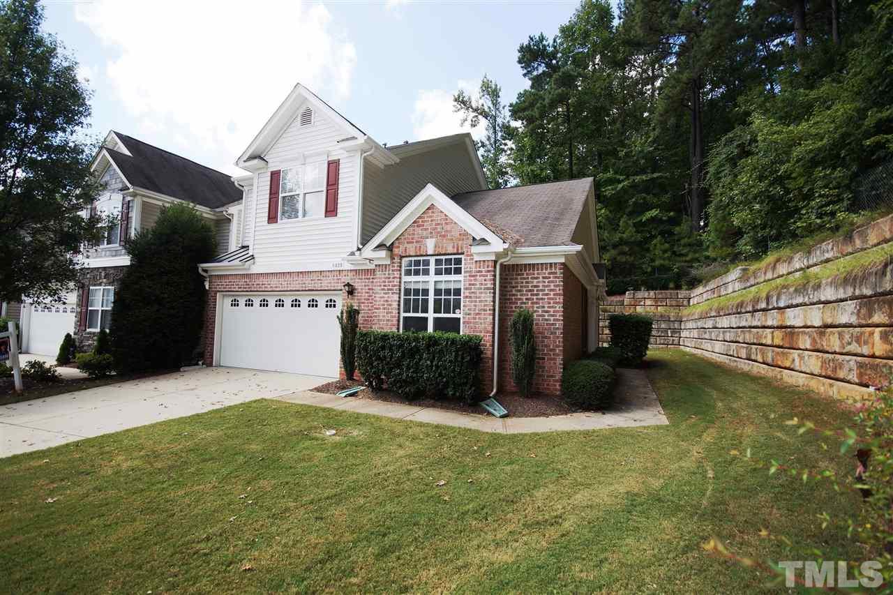 8429 Header Stone Drive Raleigh, NC 27613 - Photo 1 of 19 a front view of a house with a yard