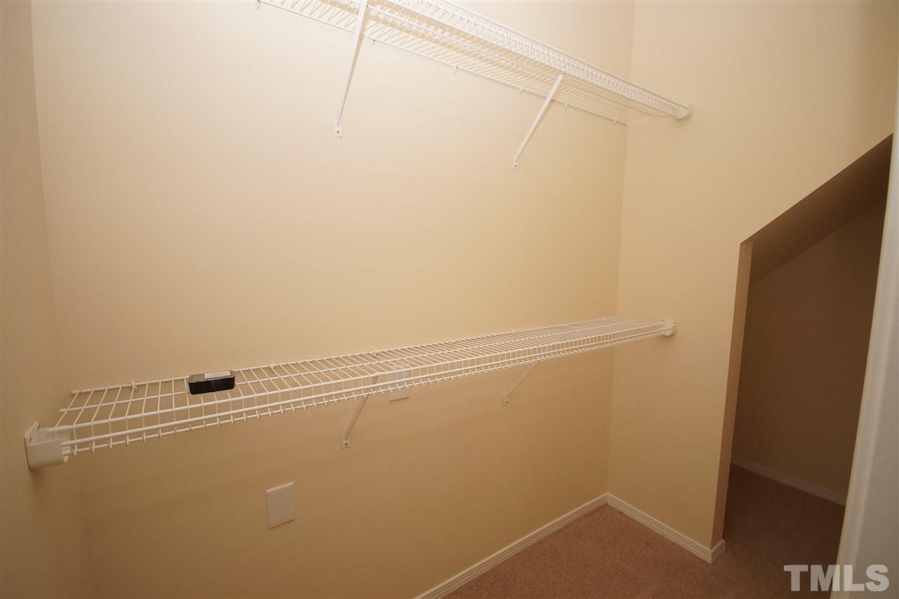 8429 Header Stone Drive Raleigh, NC 27613 - Photo 12 of 19 a view of a room with racks on the wall