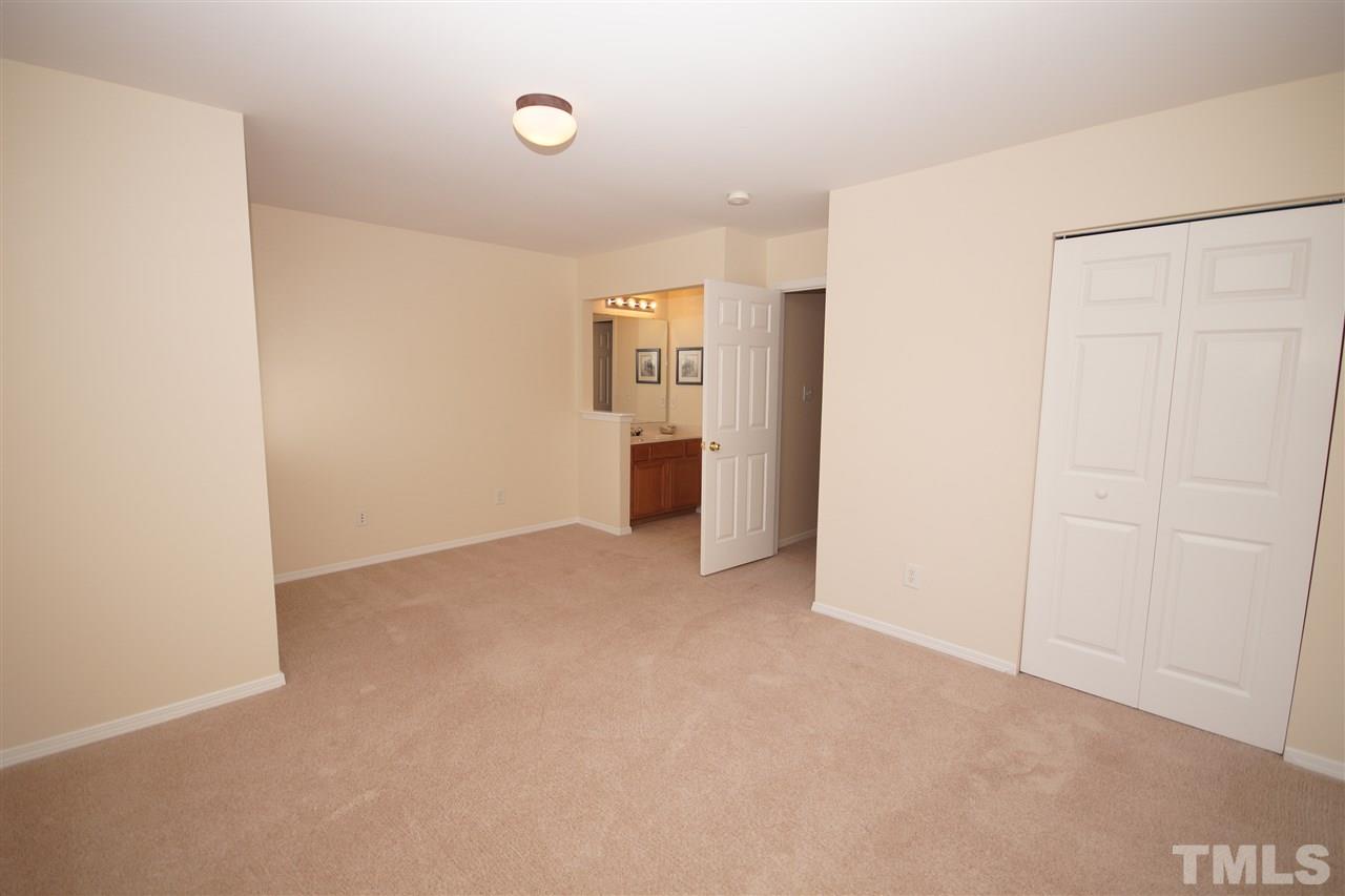 8429 Header Stone Drive Raleigh, NC 27613 - Photo 16 of 19 a view of an empty room with closet and a window