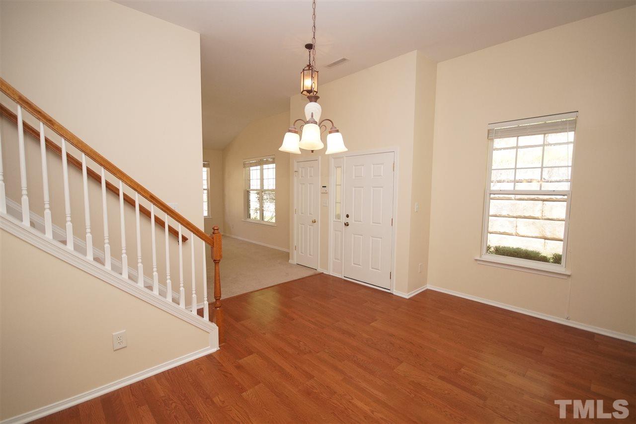 8429 Header Stone Drive Raleigh, NC 27613 - Photo 3 of 19 a view of an entryway with wooden floor