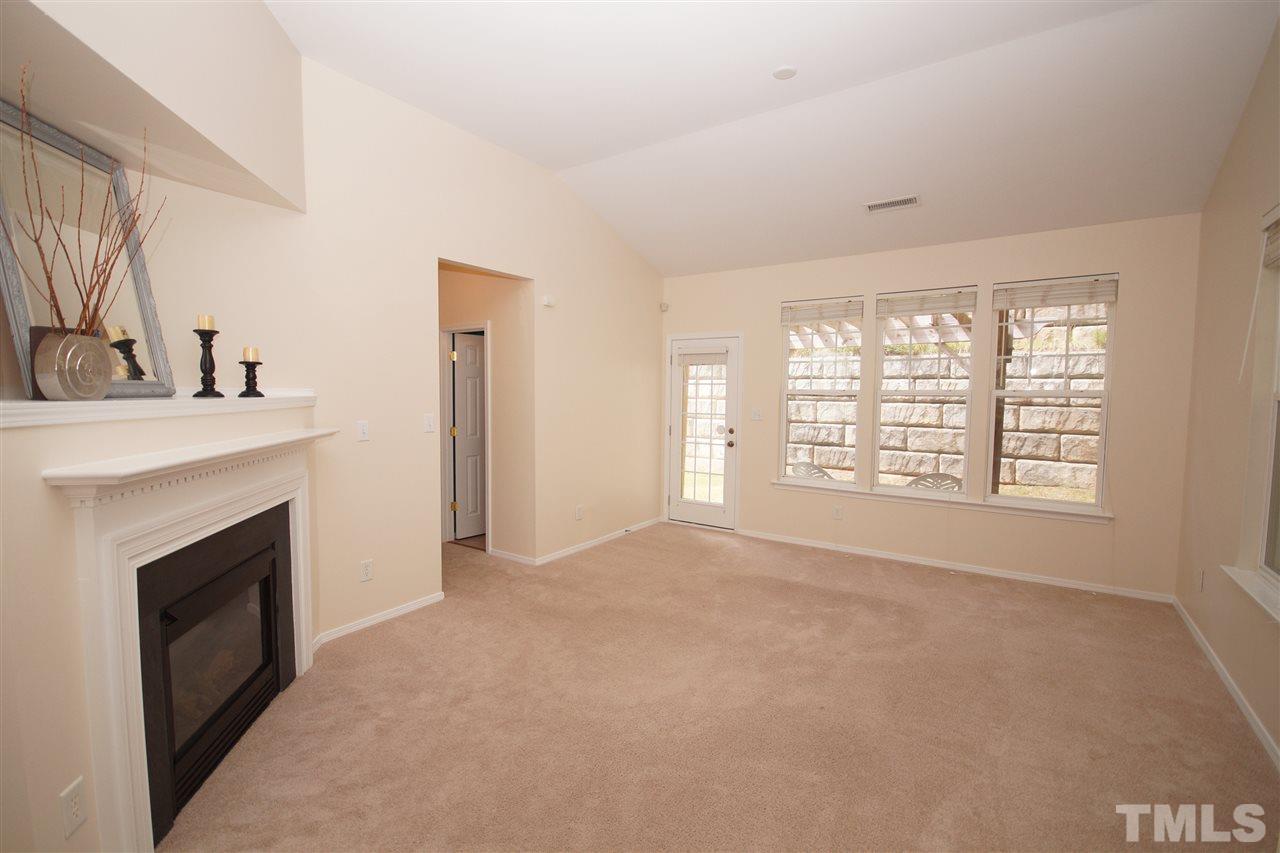 8429 Header Stone Drive Raleigh, NC 27613 - Photo 4 of 19 a view of empty room with a fireplace