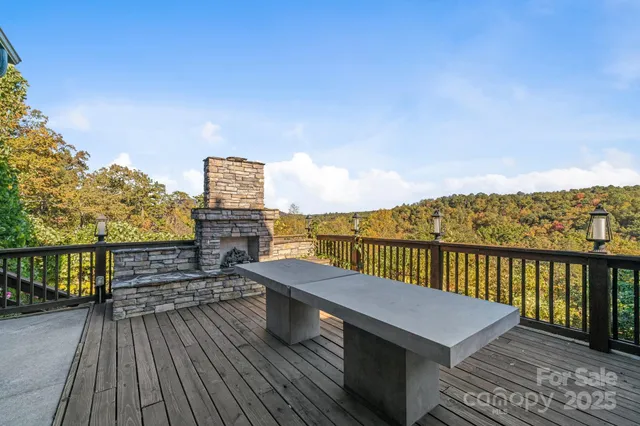 a view of a balcony with wooden floor and city view
