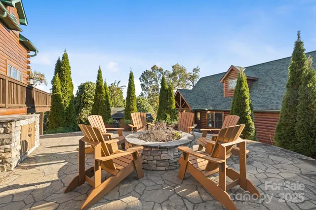 a view of a patio with table and chairs and potted plants