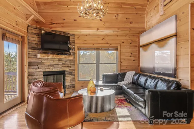 a bedroom with a bed a dresser next to a window