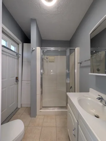 a bathroom with a sink a toilet and bathtub