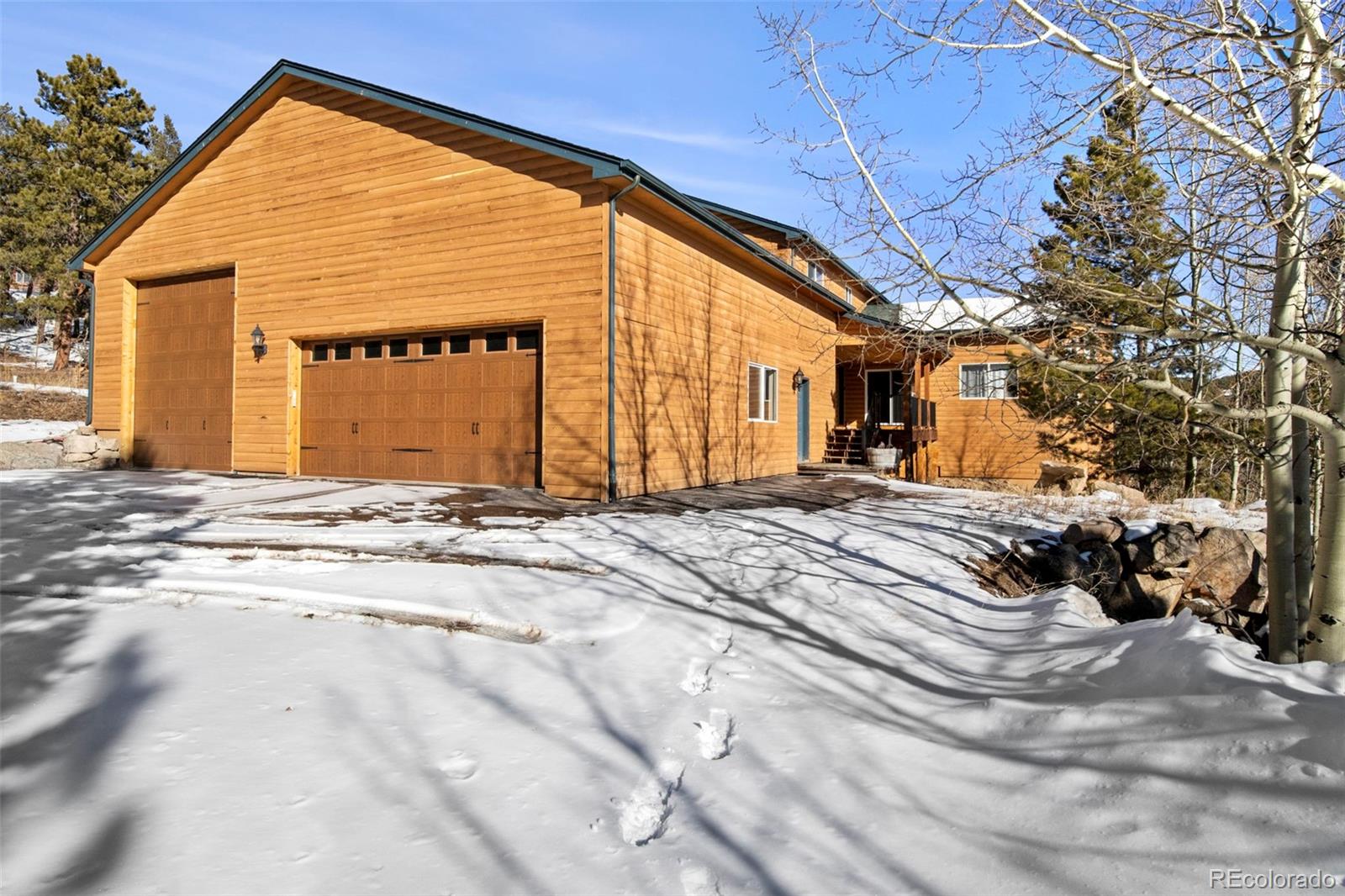 412 Evergreen Road Black Hawk, CO 80422 - Photo 4 of 48 a view of a house with a snow on the road