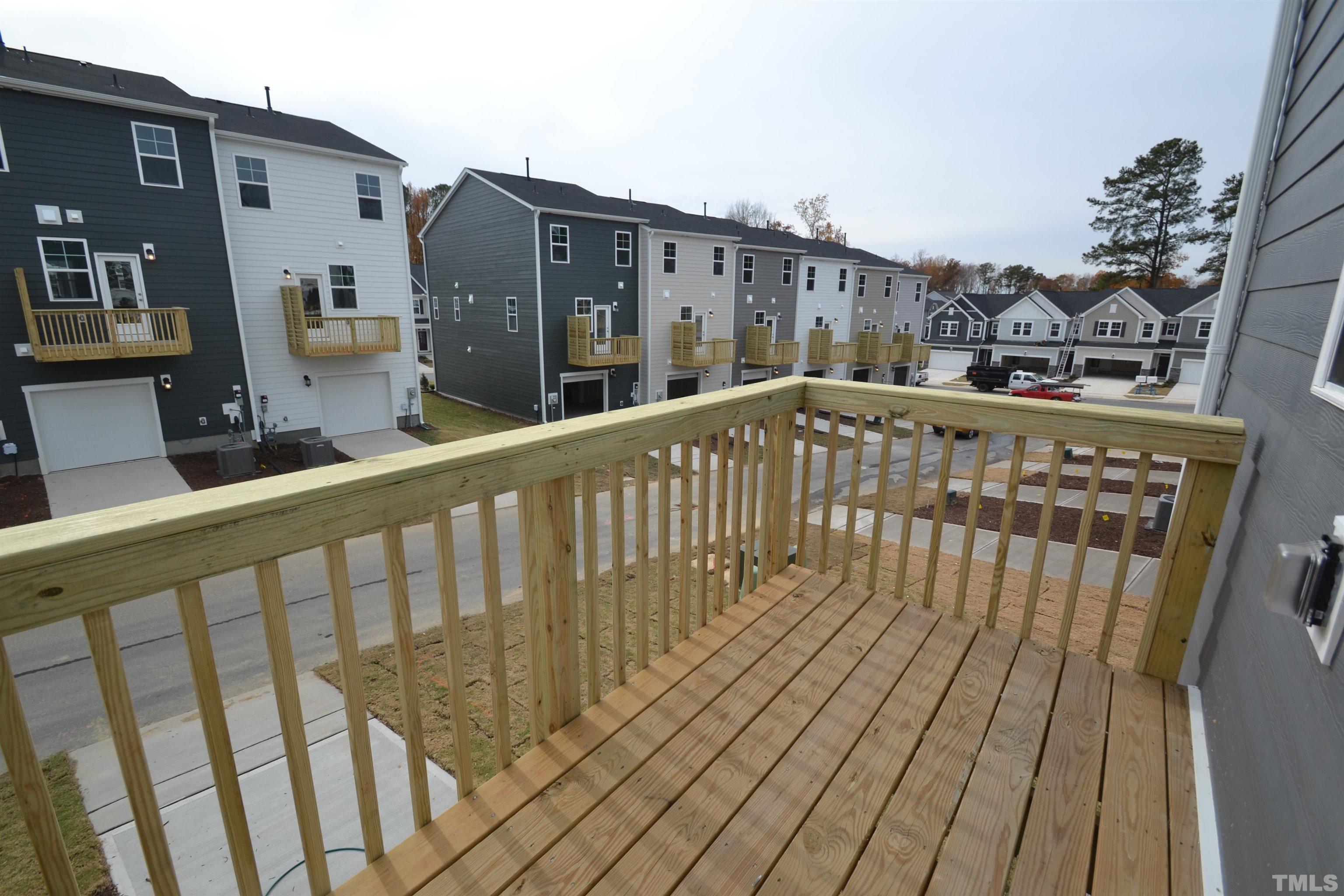 1837 Joscara Lane Apex, NC 27502 - Photo 24 of 45 a view of wooden balcony with furniture