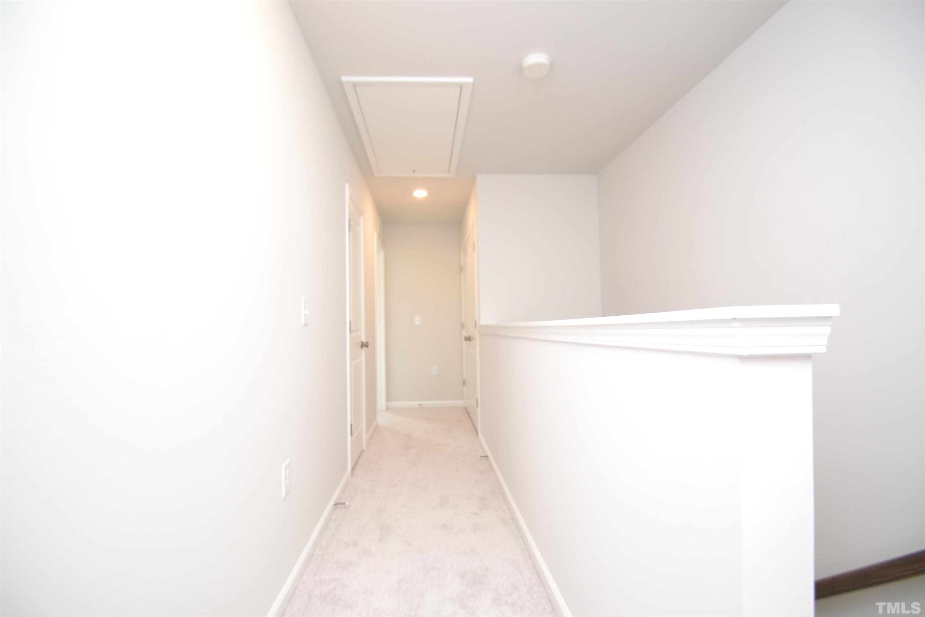 1837 Joscara Lane Apex, NC 27502 - Photo 25 of 45 a view of a room with door