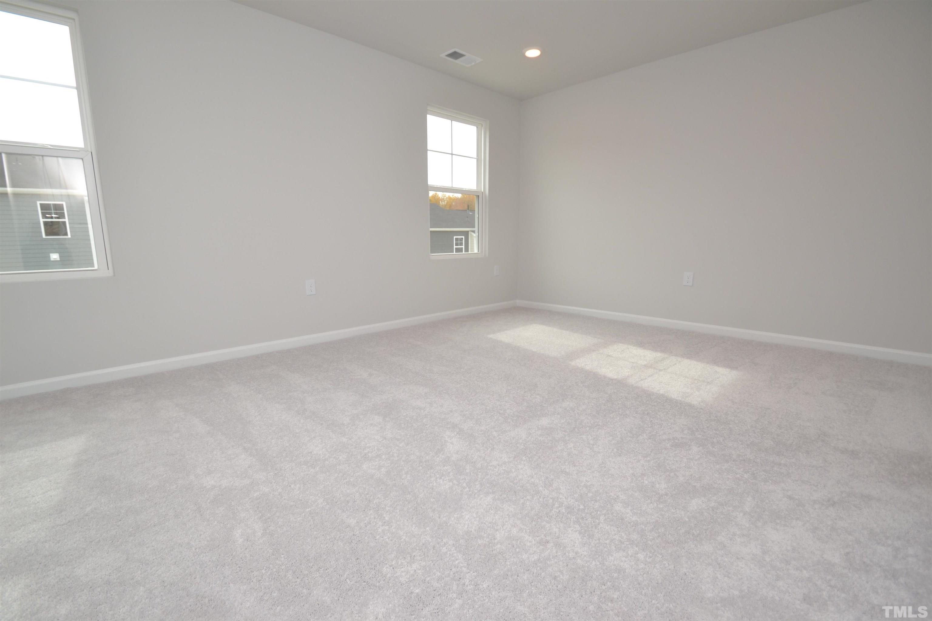 1837 Joscara Lane Apex, NC 27502 - Photo 34 of 45 an empty room with windows and closet