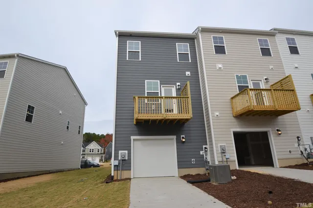 a front view of a house with a garage