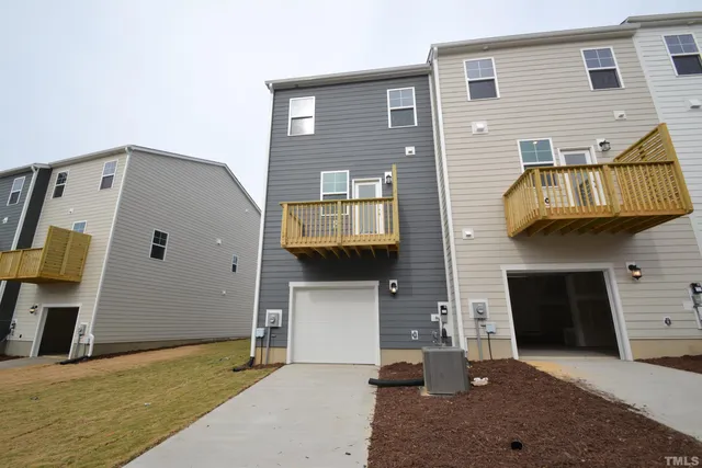 a front view of a house with a garage