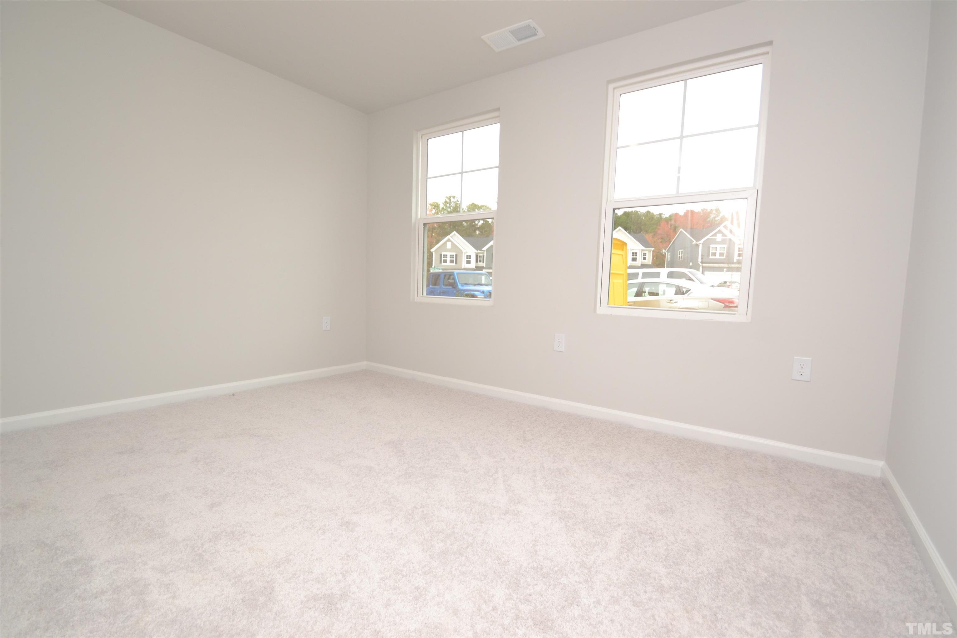 1837 Joscara Lane Apex, NC 27502 - Photo 6 of 45 an empty room with windows