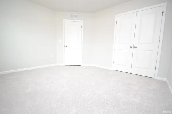 an empty room with an entryway