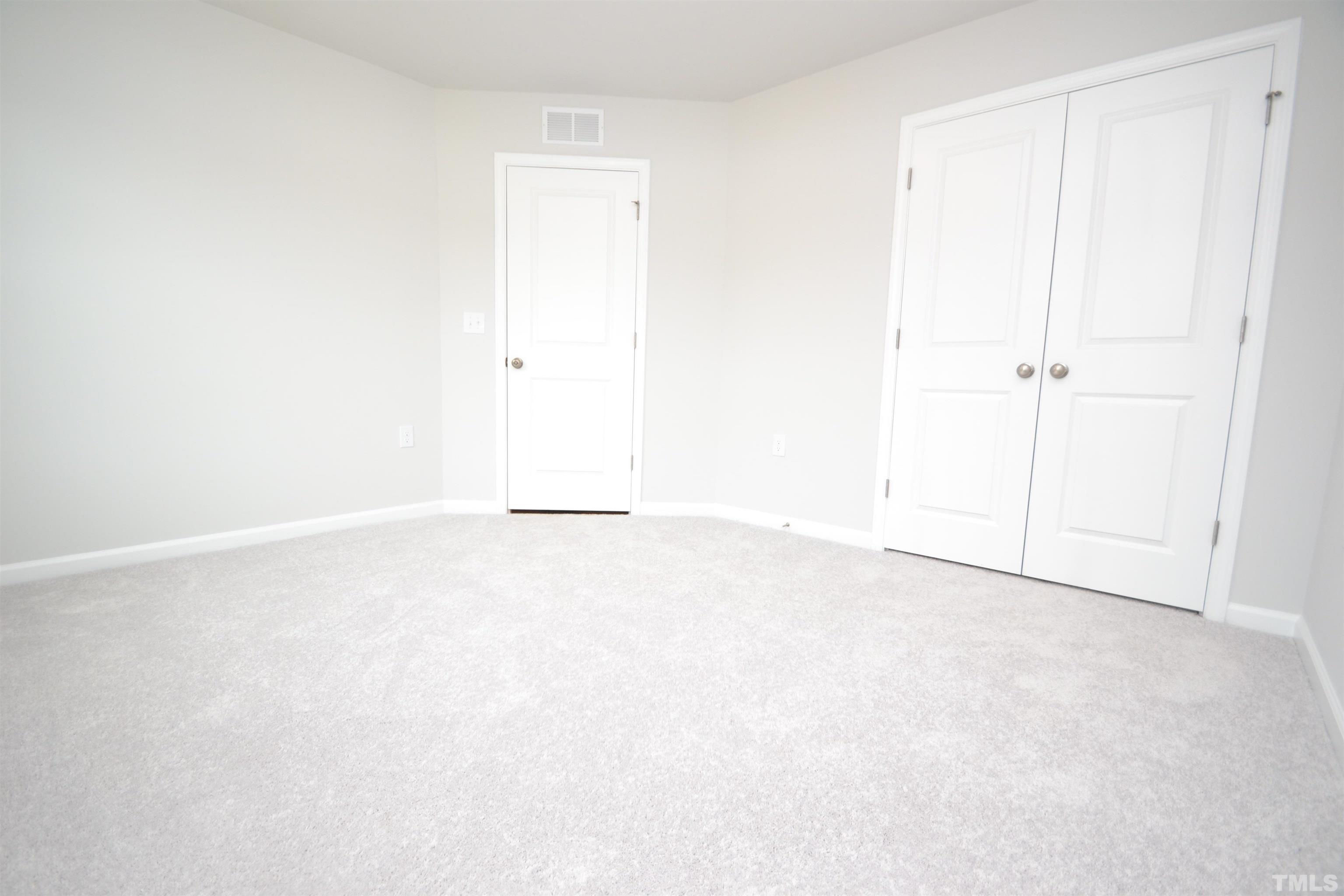 1837 Joscara Lane Apex, NC 27502 - Photo 7 of 45 an empty room with an entryway