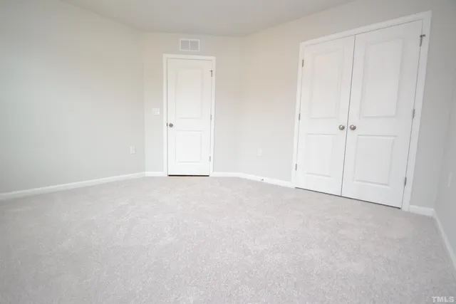 a view of an empty room and entryway
