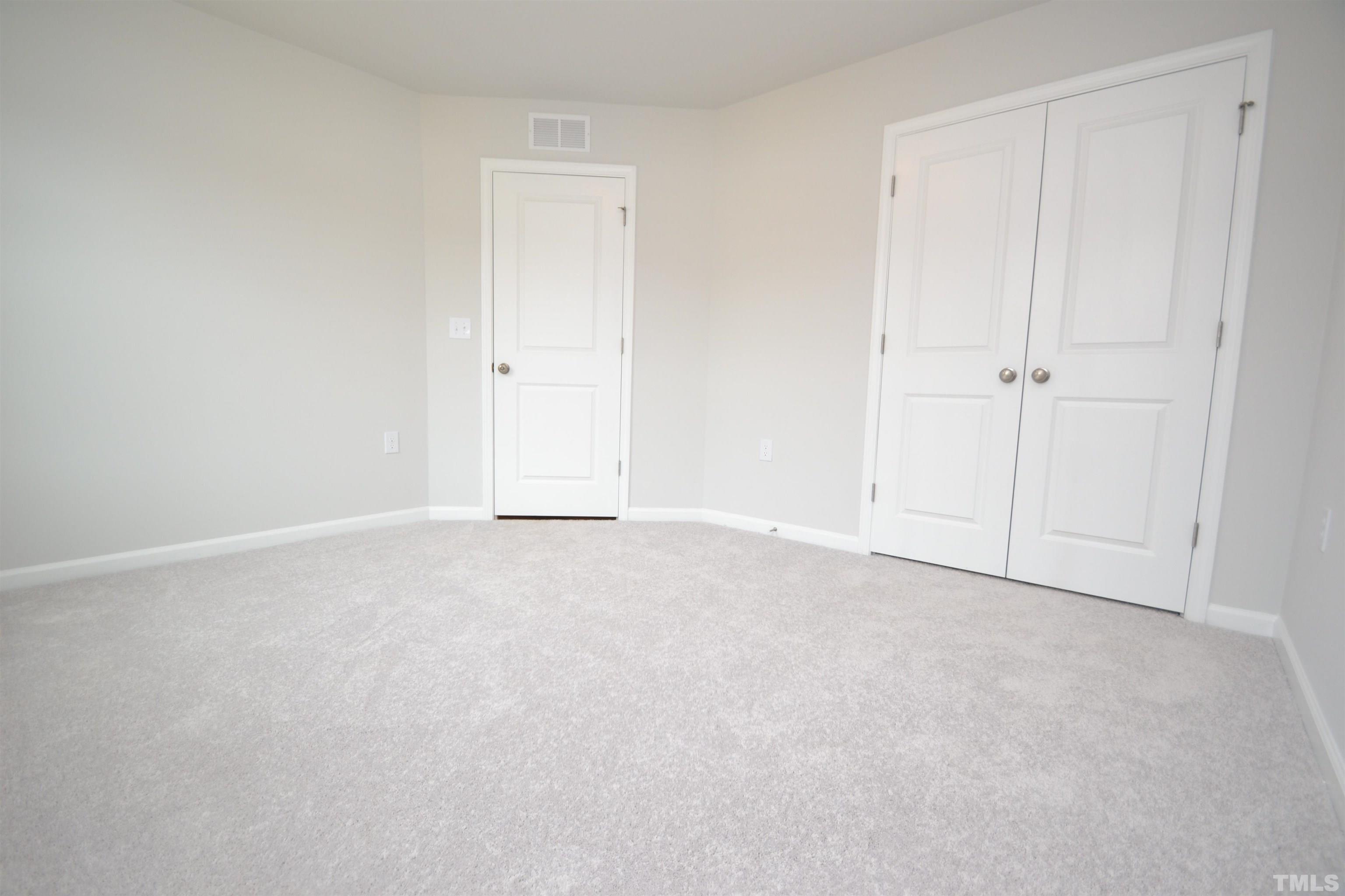 1837 Joscara Lane Apex, NC 27502 - Photo 8 of 45 a view of an empty room and entryway