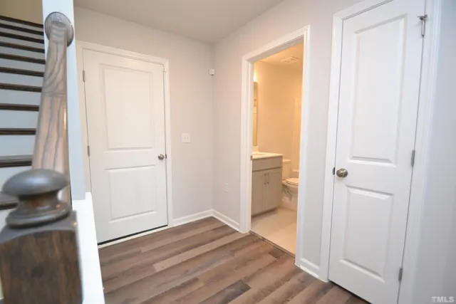 a view of a bedroom from a hallway