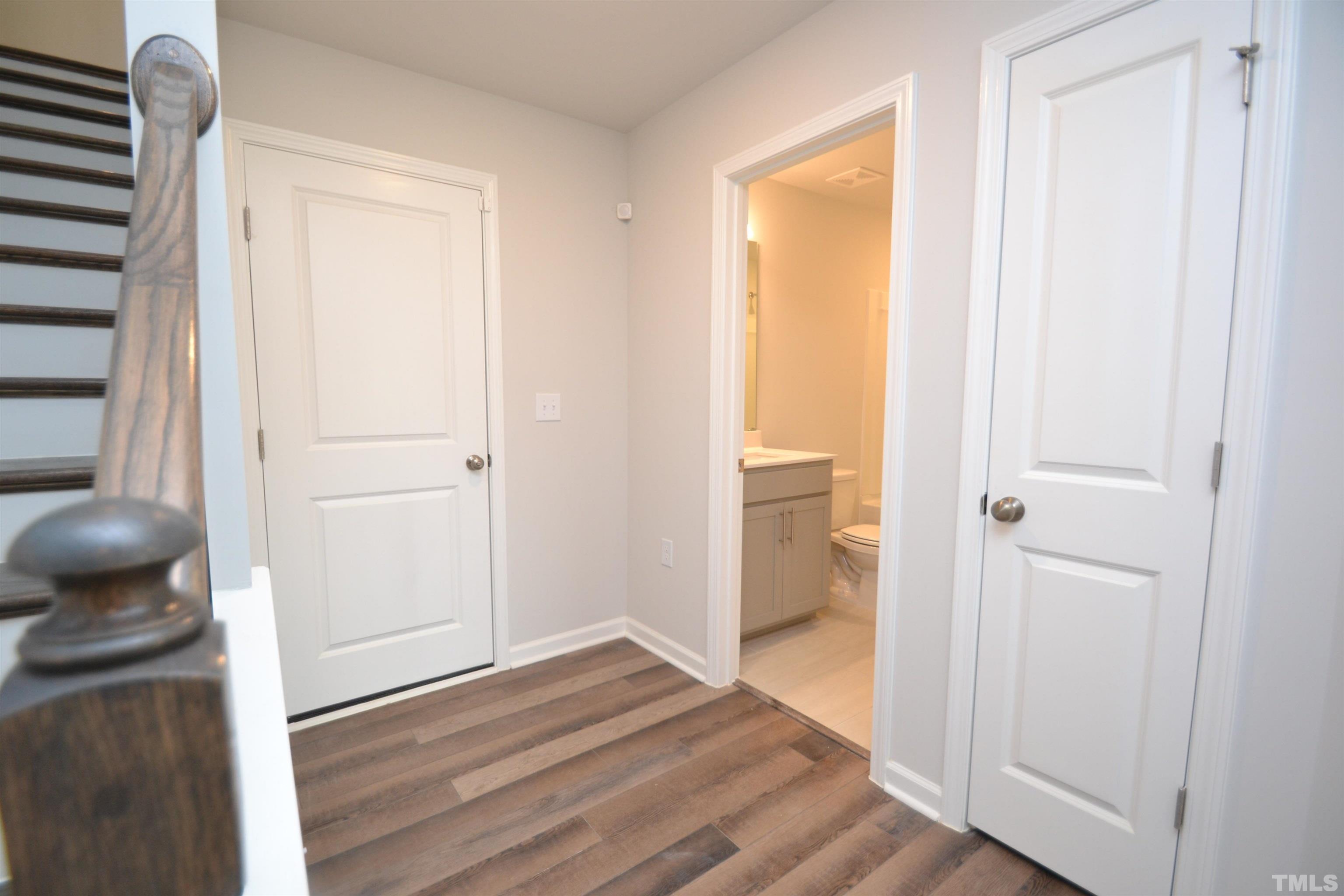 1837 Joscara Lane Apex, NC 27502 - Photo 9 of 45 a view of a bedroom from a hallway