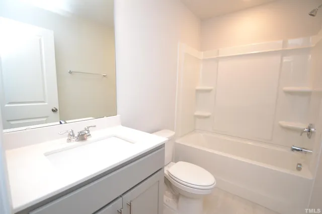 a bathroom with a sink a toilet and a bathtub