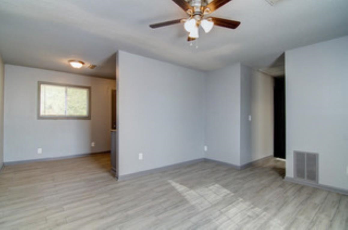 396 West Holmes Road Memphis, TN 38109 - Photo 3 of 12 a view of an empty room with a window
