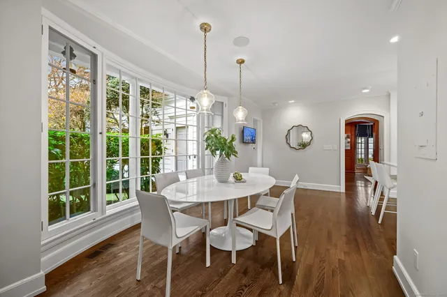 a view of a dining room with furniture window and wooden floor