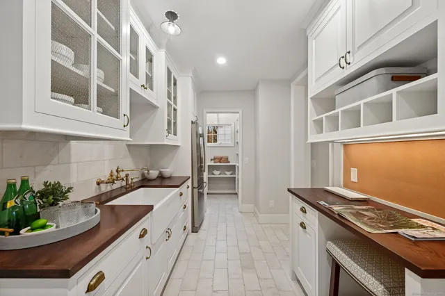 a kitchen with stainless steel appliances granite countertop a stove and a sink