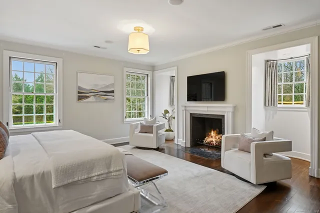 a spacious bathroom with a double vanity sink mirror and shower