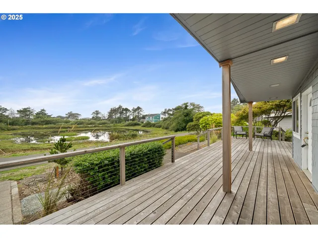 a view of a balcony with wooden floor