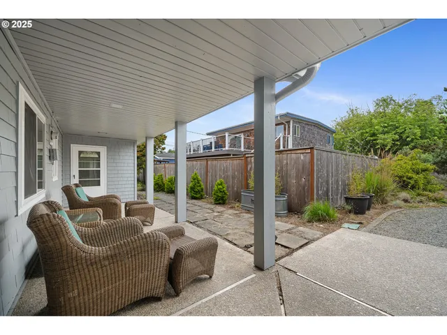 a balcony with furniture and wooden floor