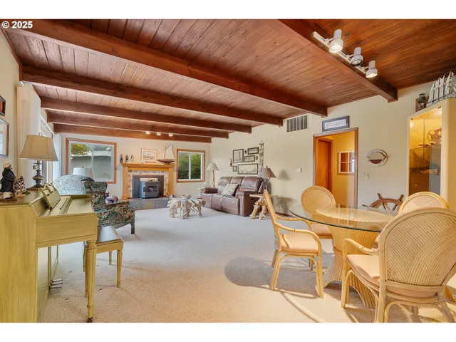 a living room with lots of furniture and a chandelier