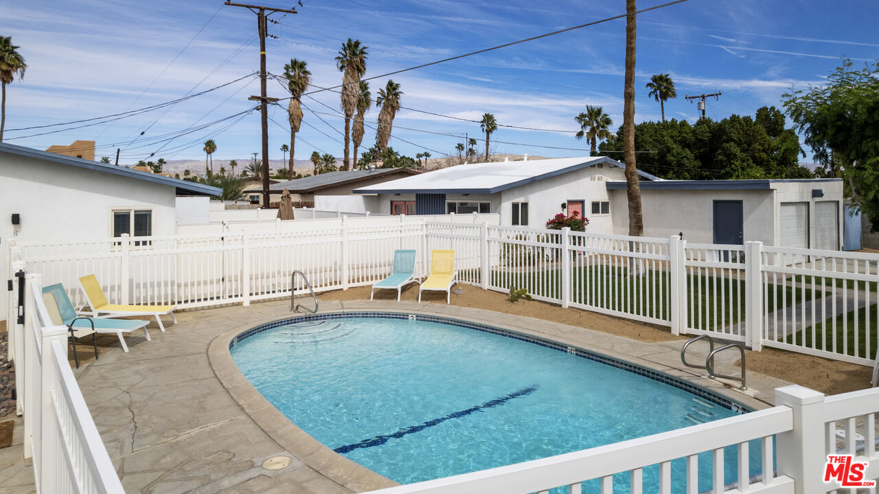 68080 Risueno Road Cathedral City, CA 92234 - Photo 5 of 14 a view of a house with swimming pool and sitting area