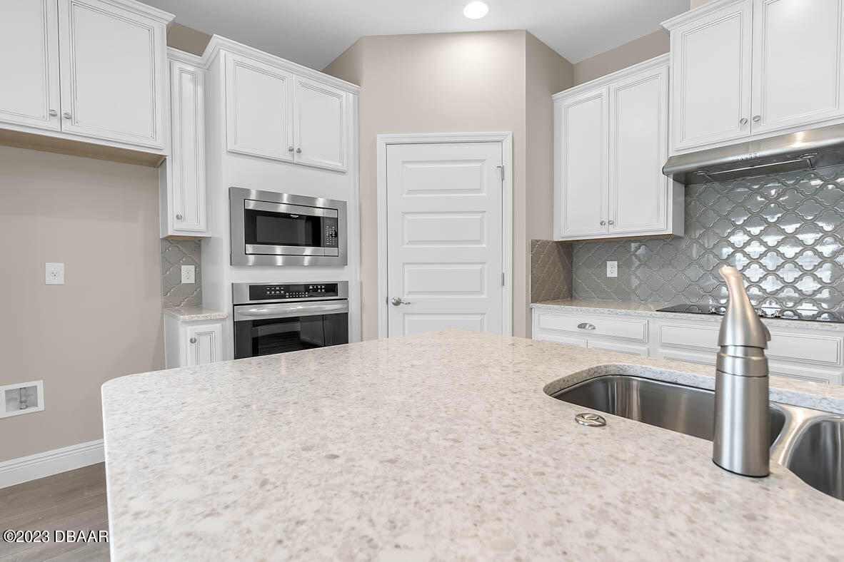 2974 Monaghan Drive Ormond Beach, FL 32174 - Photo 7 of 27 5 kitchen 2