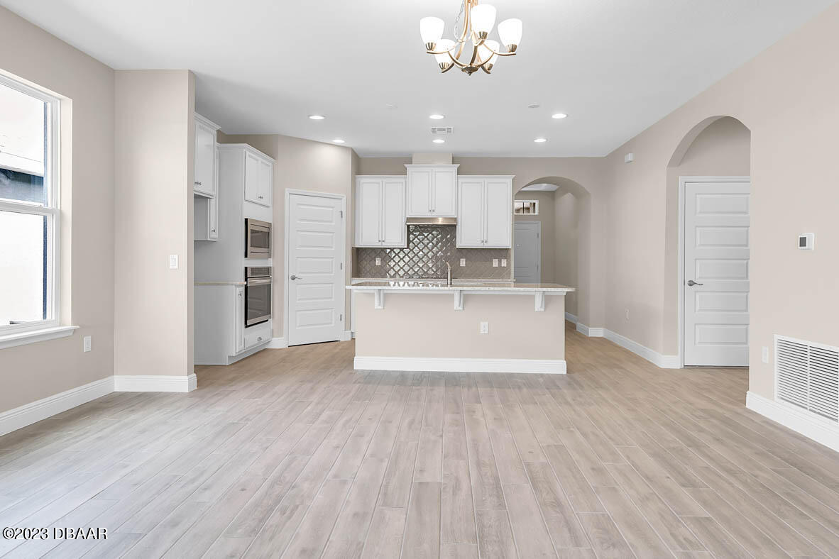 2974 Monaghan Drive Ormond Beach, FL 32174 - Photo 10 of 27 8 living room_kitchen
